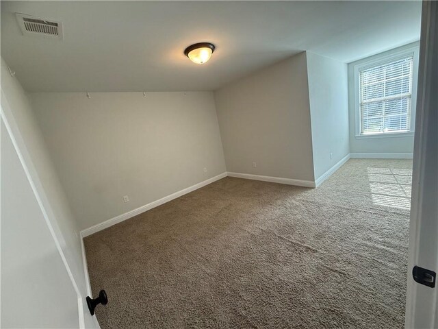 unfurnished room featuring carpet floors