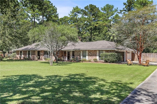 ranch-style home featuring a front yard