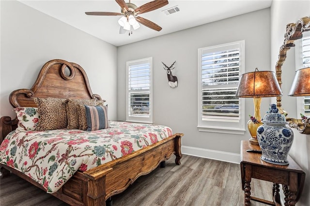 bedroom featuring wood-type flooring and ceiling fan