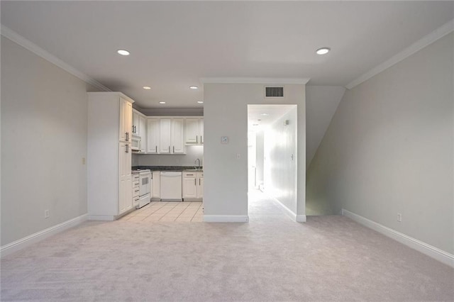 kitchen featuring light carpet, sink, white appliances, and ornamental molding