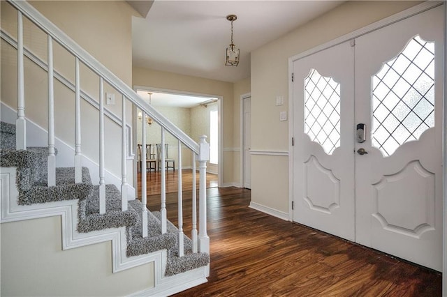 entryway with a healthy amount of sunlight and dark wood-type flooring