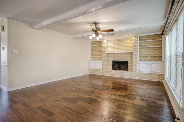 unfurnished living room featuring ceiling fan, beam ceiling, dark hardwood / wood-style floors, a fireplace, and built in shelves