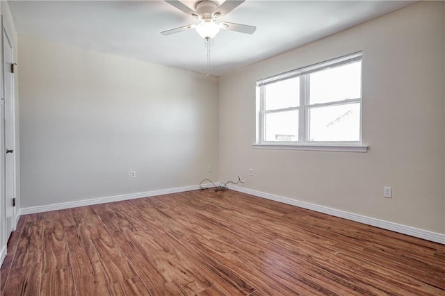 spare room with ceiling fan and hardwood / wood-style floors