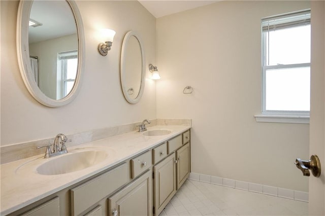 bathroom with vanity and tile patterned flooring