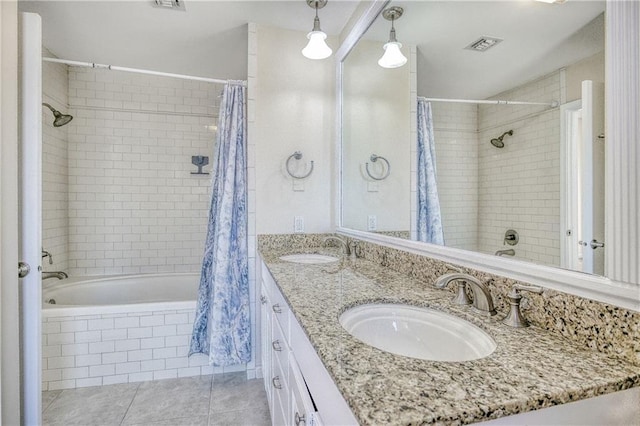 bathroom featuring vanity, tile patterned floors, and shower / tub combo with curtain