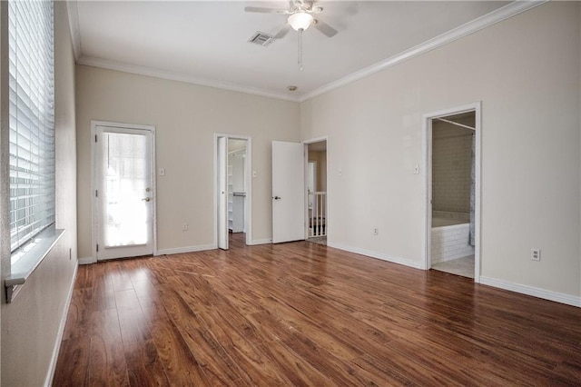 spare room featuring crown molding, dark hardwood / wood-style floors, and ceiling fan