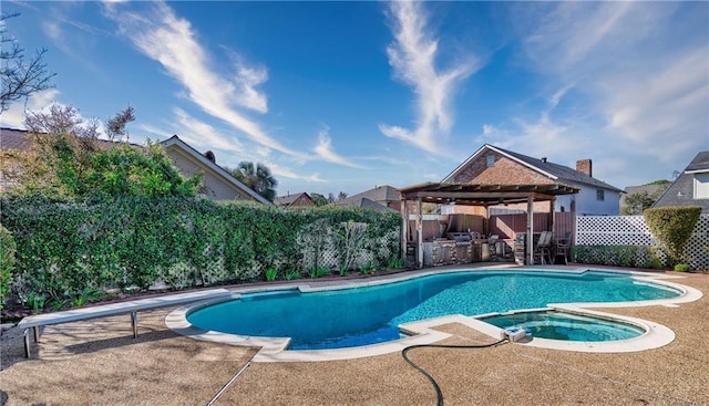 view of pool featuring area for grilling, a gazebo, a patio area, and an in ground hot tub