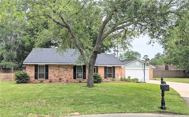 ranch-style home with a garage and a front lawn