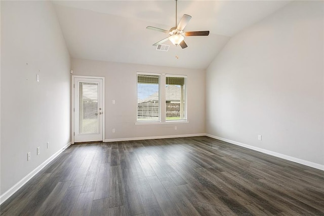 spare room with vaulted ceiling, ceiling fan, and dark wood-type flooring