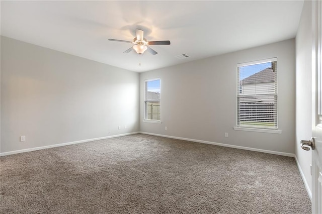 unfurnished room featuring carpet and ceiling fan