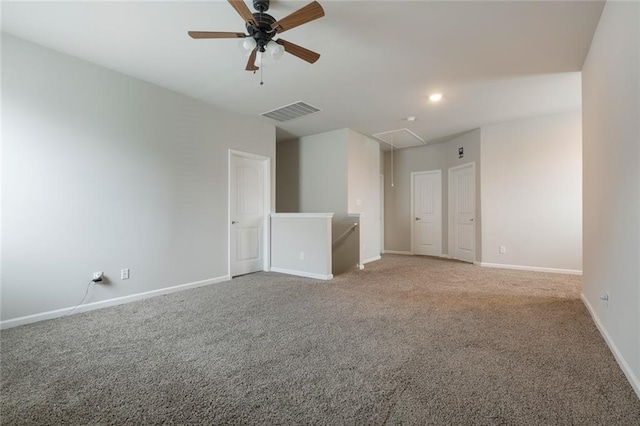 empty room featuring carpet flooring and ceiling fan