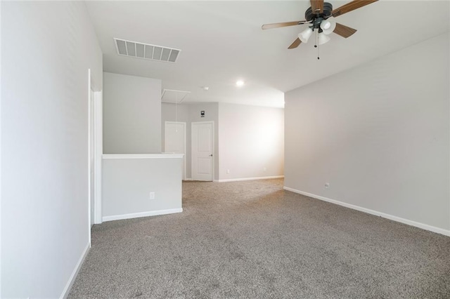 carpeted spare room featuring ceiling fan