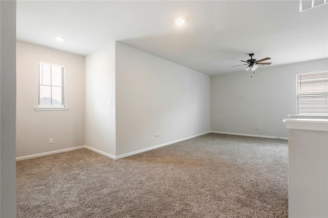 carpeted empty room with ceiling fan