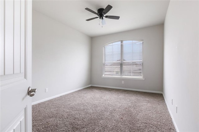 empty room featuring carpet and ceiling fan