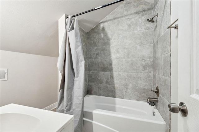 bathroom with shower / bath combo with shower curtain