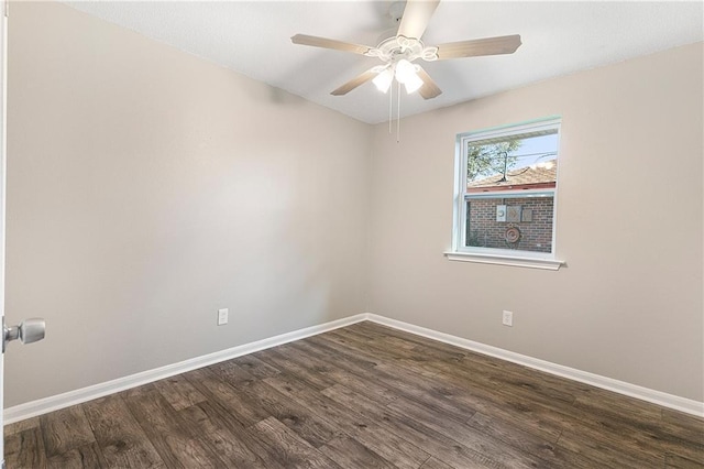 unfurnished room with ceiling fan and dark wood-type flooring