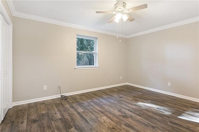 spare room with ceiling fan, dark hardwood / wood-style flooring, and crown molding