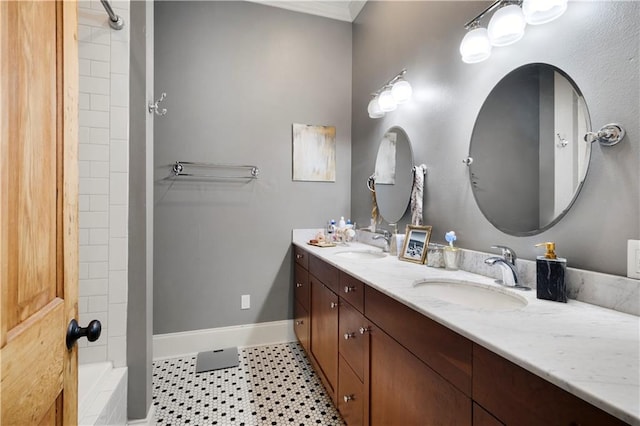 bathroom featuring tile patterned floors, vanity, and a shower