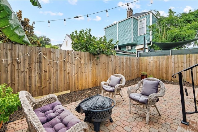 view of patio / terrace with an outdoor fire pit