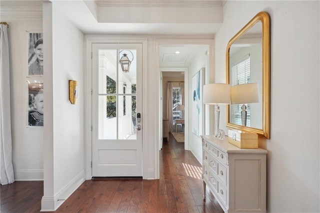 foyer entrance featuring dark hardwood / wood-style floors and ornamental molding