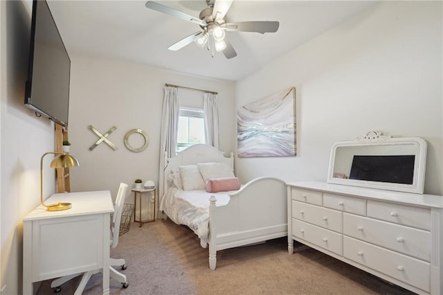 bedroom with ceiling fan and light carpet