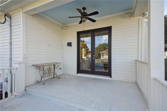 view of exterior entry featuring french doors and ceiling fan