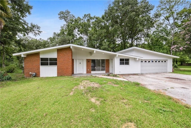 ranch-style house with a front yard and a garage