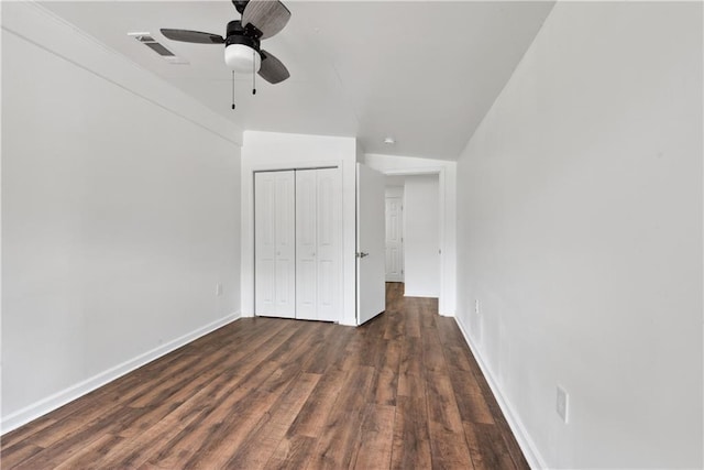 309 W Joan St, Gonzales, LA 70737 - unfurnished bedroom featuring dark hardwood / wood-style flooring, ceiling fan, a closet, and vaulted ceiling