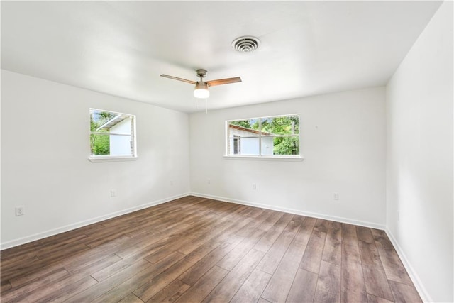 309 W Joan St, Gonzales, LA 70737 - unfurnished room with a wealth of natural light, dark hardwood / wood-style flooring, and ceiling fan
