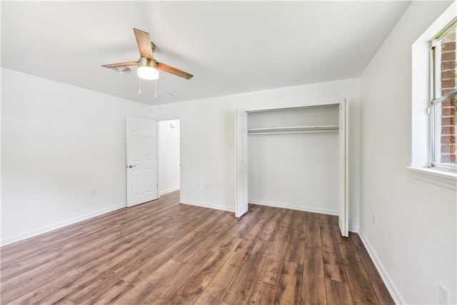 309 W Joan St, Gonzales, LA 70737 - unfurnished bedroom with dark hardwood / wood-style flooring, a closet, and ceiling fan