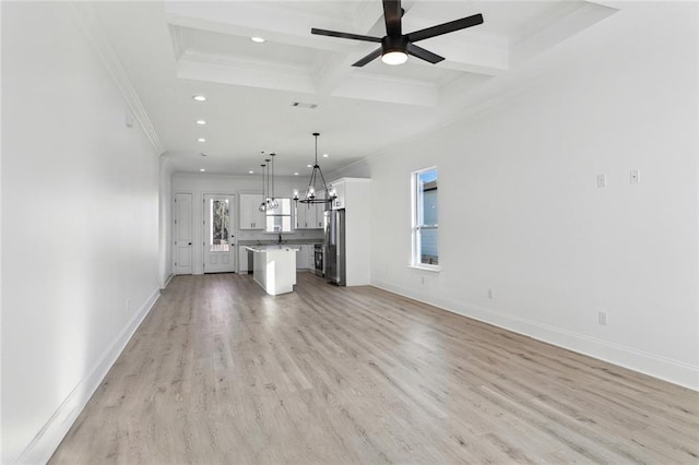 unfurnished living room featuring beamed ceiling, light hardwood / wood-style floors, ceiling fan, and crown molding