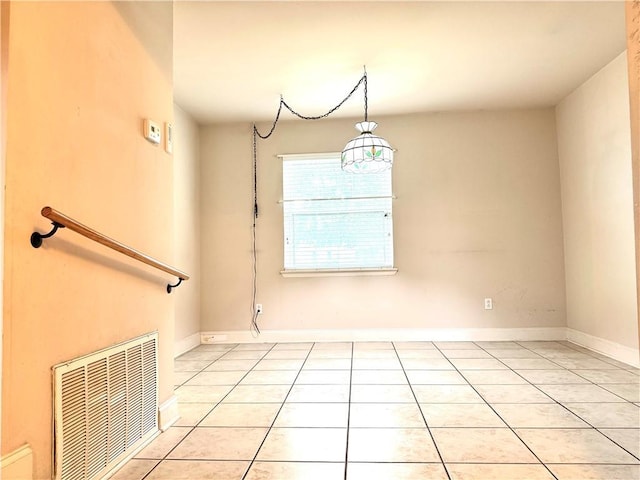 spare room with light tile patterned floors