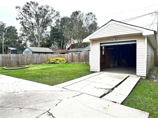 garage featuring a lawn