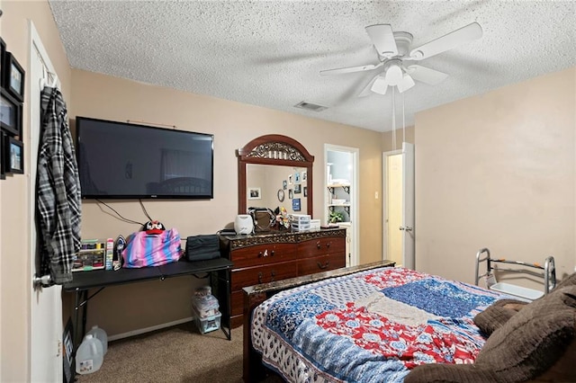 bedroom with carpet, a textured ceiling, and ceiling fan