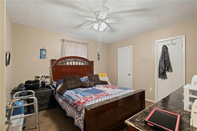 bedroom featuring carpet, ceiling fan, and a textured ceiling