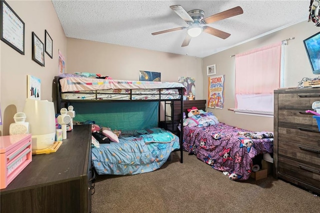 bedroom featuring ceiling fan, carpet floors, and a textured ceiling