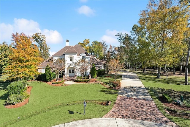 view of community featuring a lawn