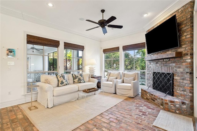 living room featuring a fireplace, ceiling fan, and ornamental molding