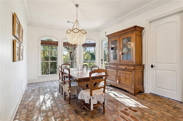 dining room featuring a chandelier and ornamental molding