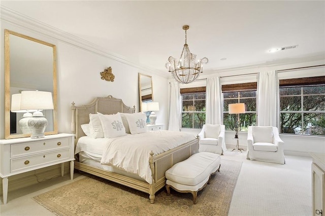 carpeted bedroom featuring a chandelier and ornamental molding