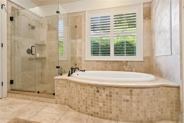 bathroom featuring tile patterned floors and independent shower and bath