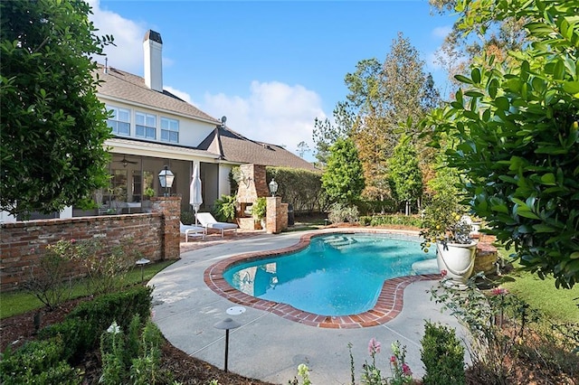 view of swimming pool with a patio area