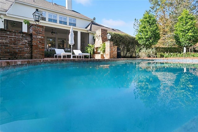 view of pool featuring ceiling fan