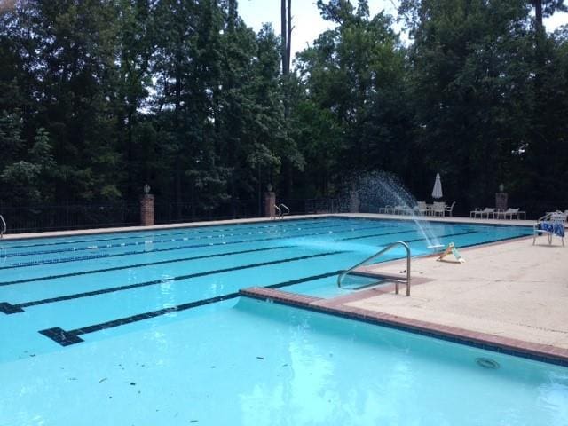 view of swimming pool with a patio area