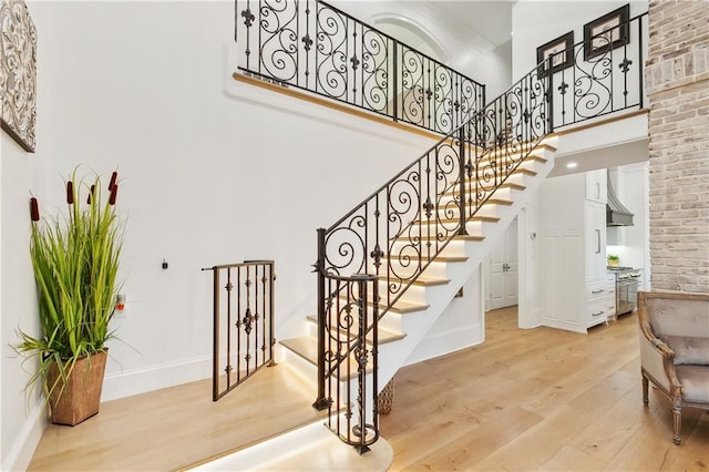 stairs with hardwood / wood-style floors