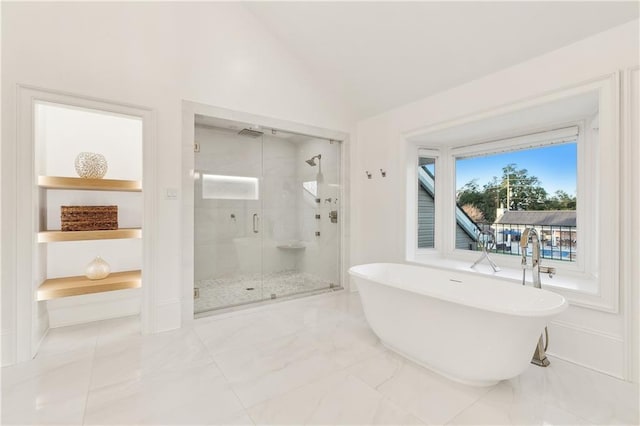 bathroom featuring plus walk in shower and lofted ceiling