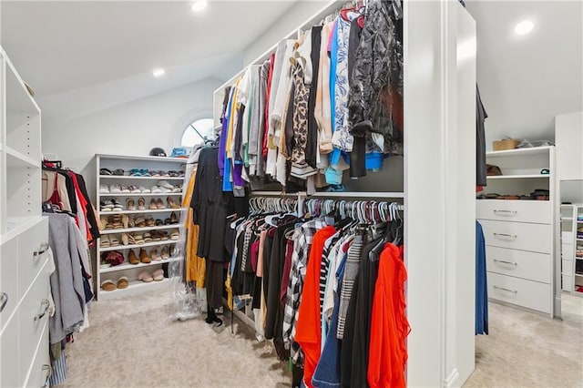 walk in closet with vaulted ceiling