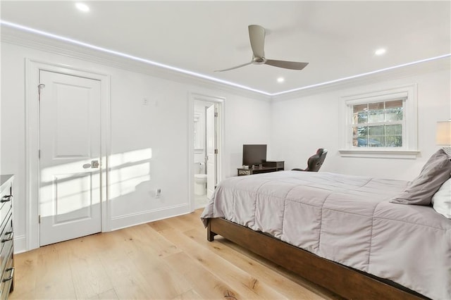 bedroom with connected bathroom, ceiling fan, crown molding, and light wood-type flooring