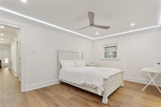 bedroom with light hardwood / wood-style flooring and ceiling fan