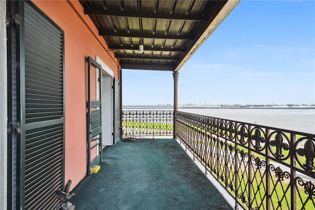 balcony featuring a water view